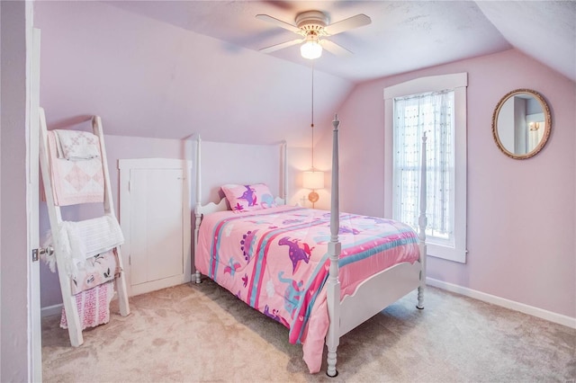 bedroom with ceiling fan, light carpet, and vaulted ceiling