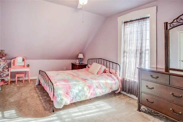 carpeted bedroom featuring lofted ceiling and ceiling fan