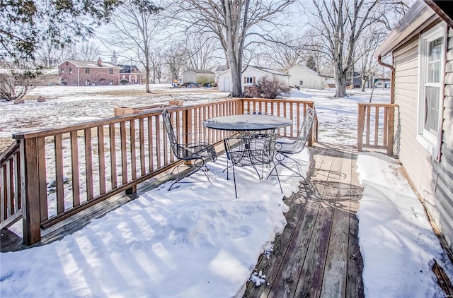 view of snow covered deck