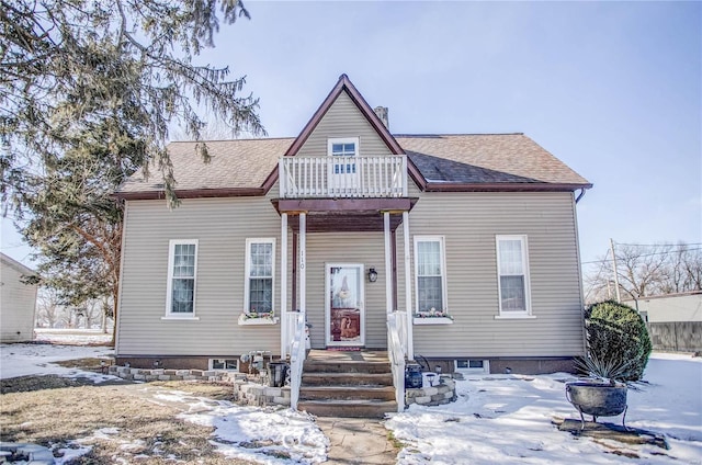 view of front of house with a balcony