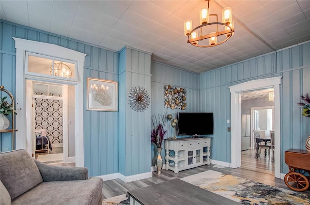 living room featuring hardwood / wood-style flooring and a chandelier