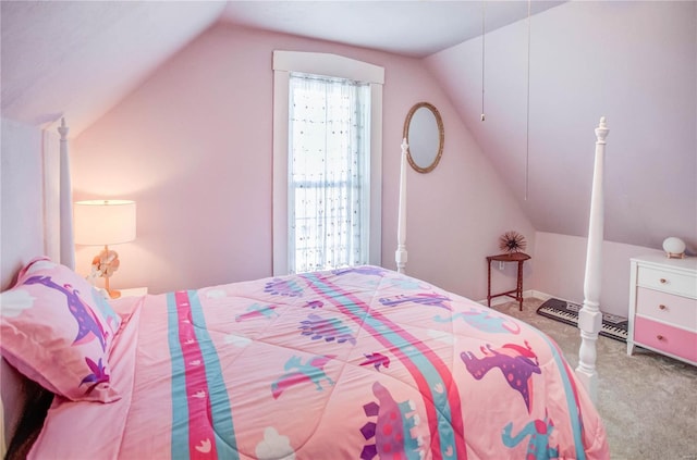 bedroom with lofted ceiling and carpet floors