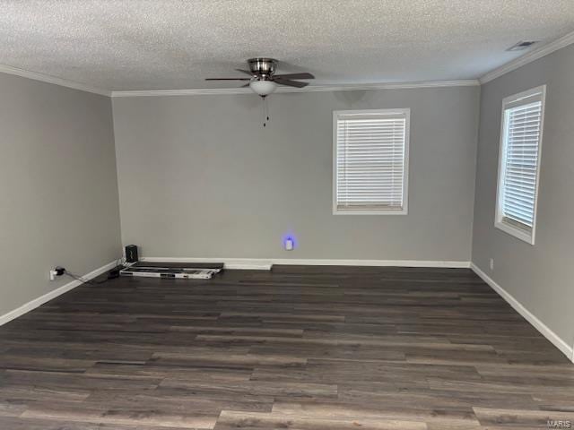 empty room with a textured ceiling, ceiling fan, crown molding, and dark hardwood / wood-style floors