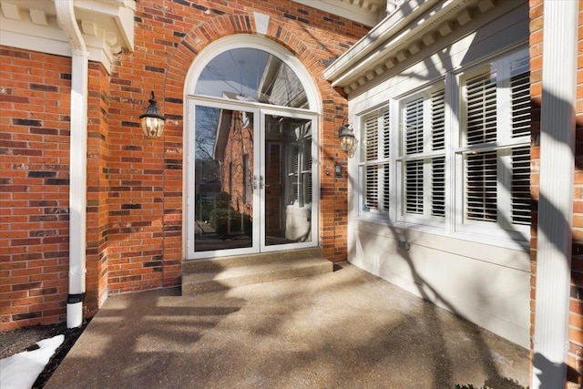 doorway to property with a patio area