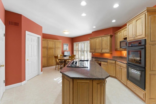 kitchen featuring a center island and black appliances