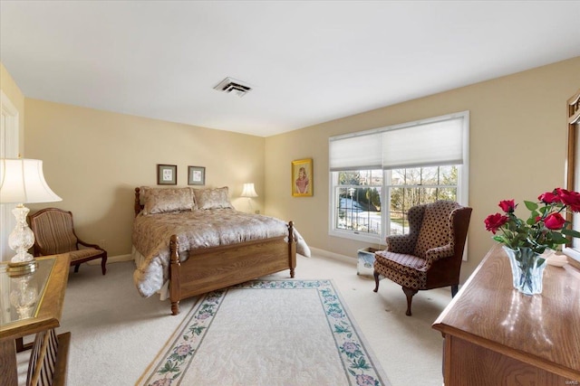 bedroom with light colored carpet