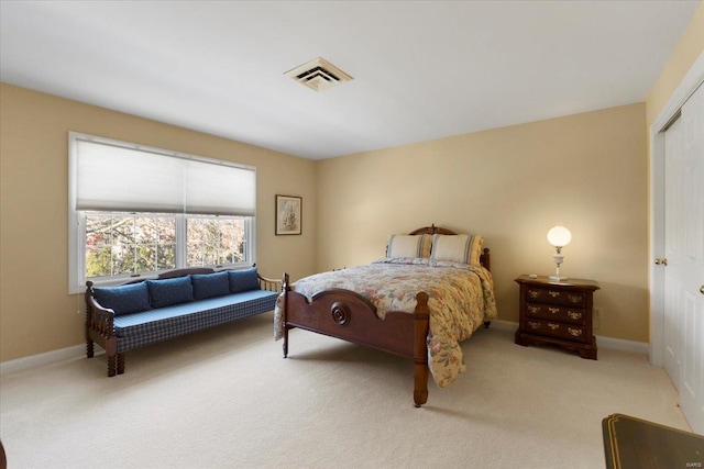 carpeted bedroom featuring a closet