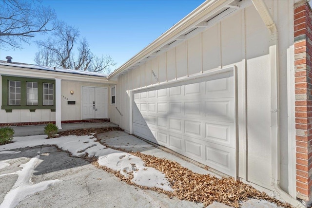 doorway to property featuring a garage