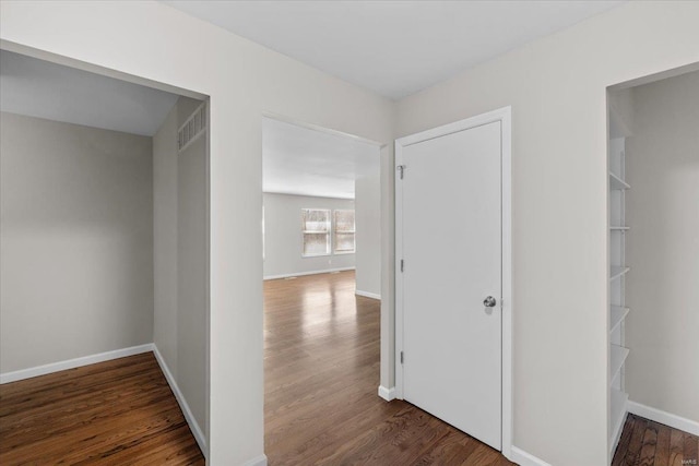 hallway featuring dark hardwood / wood-style floors