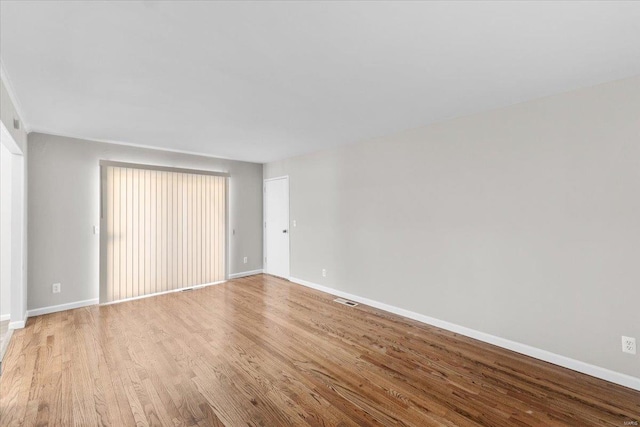 unfurnished room featuring light hardwood / wood-style floors