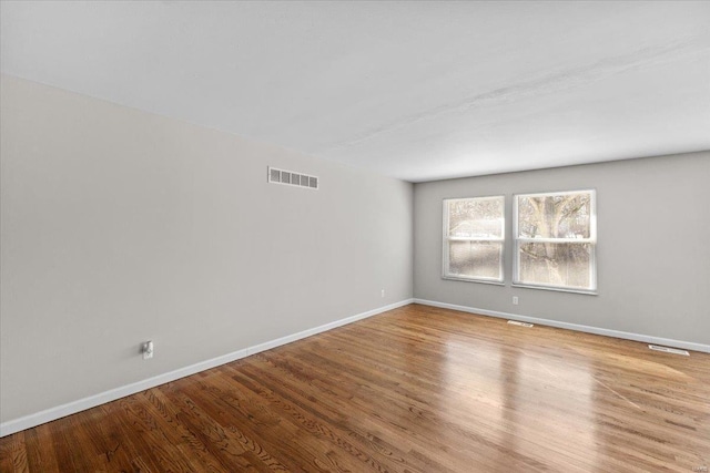 spare room with light wood-type flooring