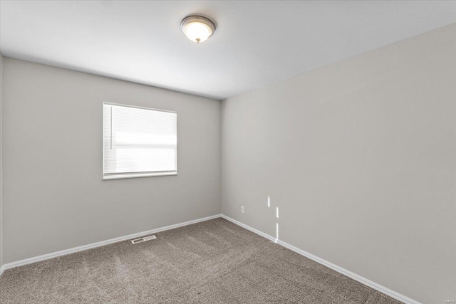 empty room with carpet flooring