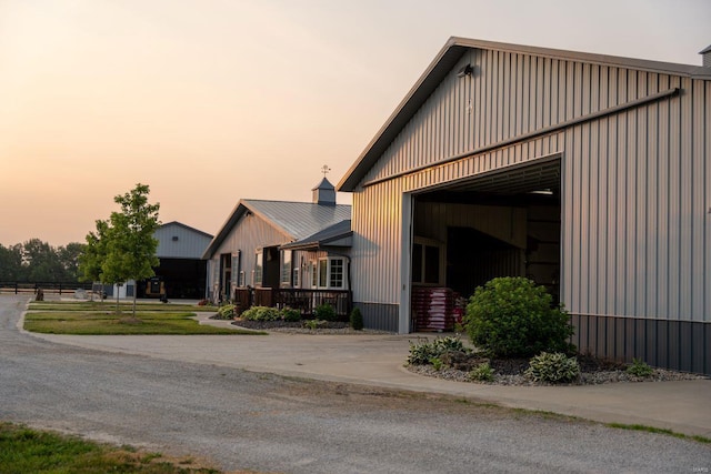 property exterior at dusk featuring a garage