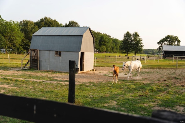 exterior space with a yard and a rural view