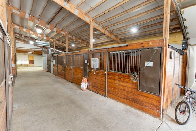 view of horse barn featuring electric panel