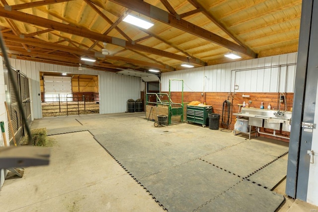 interior space with wood walls and vaulted ceiling