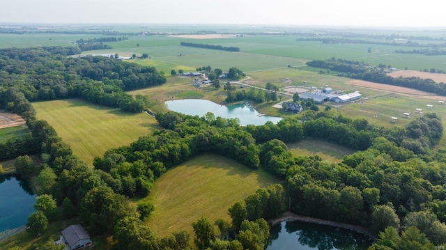 drone / aerial view featuring a water view and a rural view