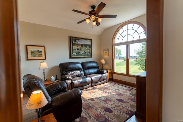 living room featuring wood-type flooring, ceiling fan, lofted ceiling, and plenty of natural light