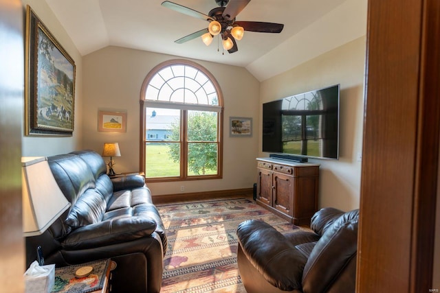 living room with ceiling fan and lofted ceiling