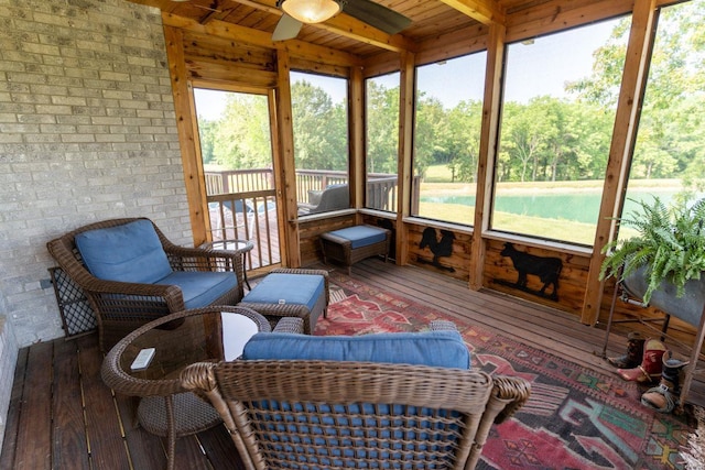 sunroom / solarium with ceiling fan and wooden ceiling