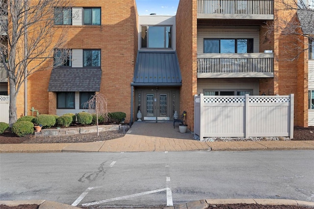 view of property with fence