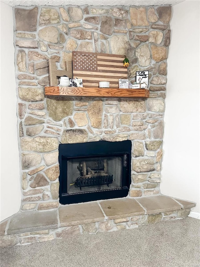 details featuring a stone fireplace