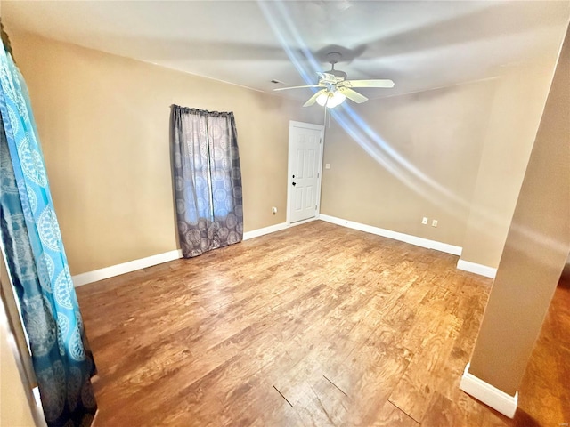 interior space featuring ceiling fan and wood-type flooring