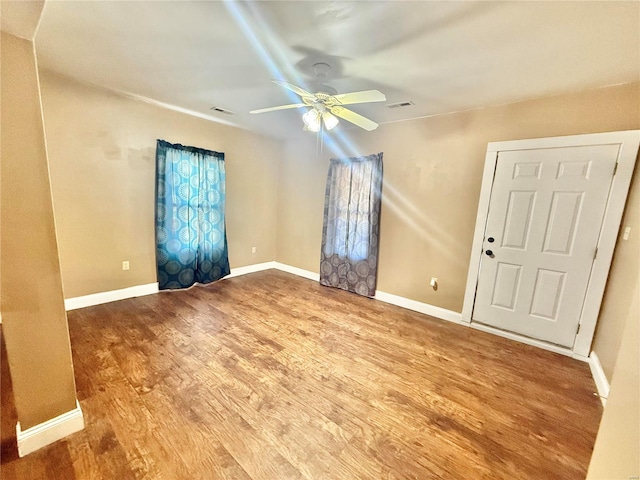 unfurnished room featuring ceiling fan and wood-type flooring