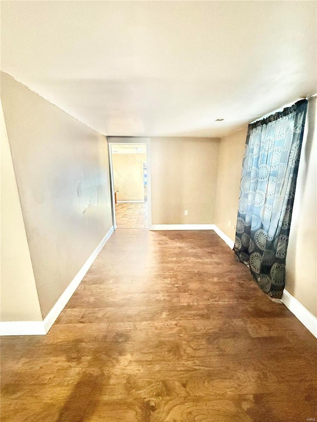 spare room with hardwood / wood-style flooring