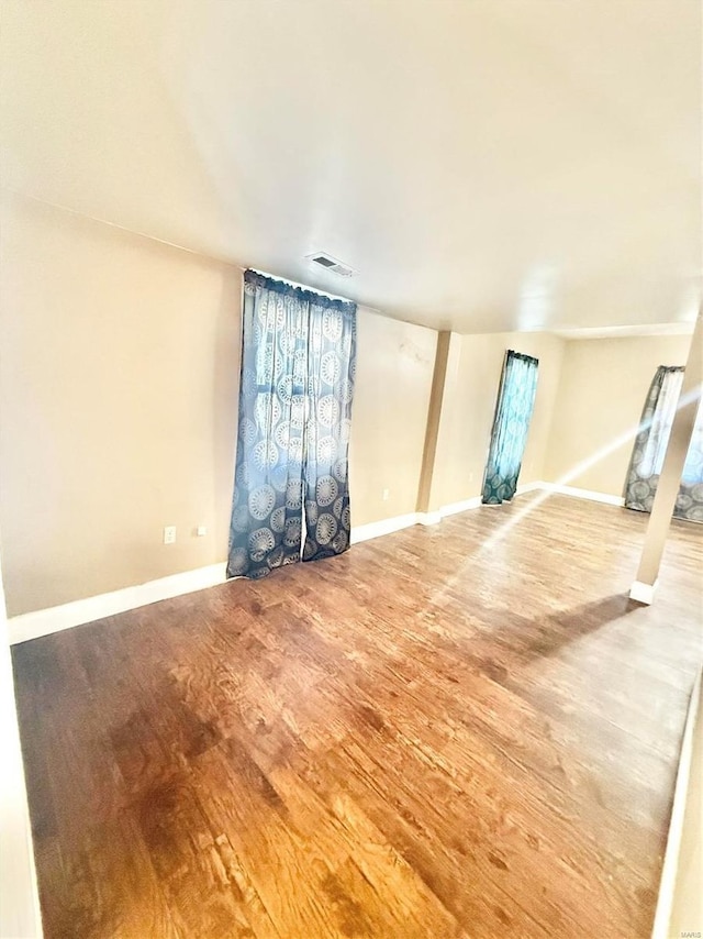 unfurnished living room featuring hardwood / wood-style flooring