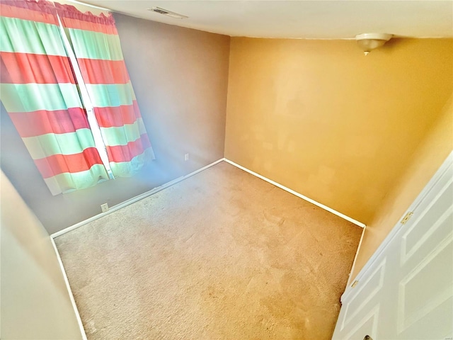 unfurnished room featuring carpet floors