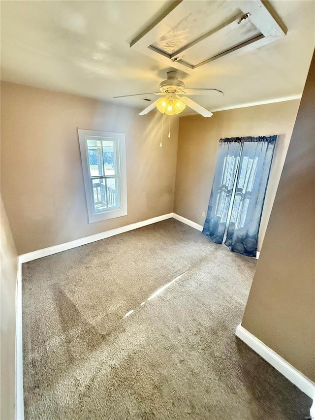 spare room featuring carpet floors and ceiling fan