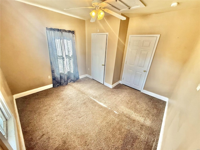 unfurnished bedroom with ceiling fan and carpet floors