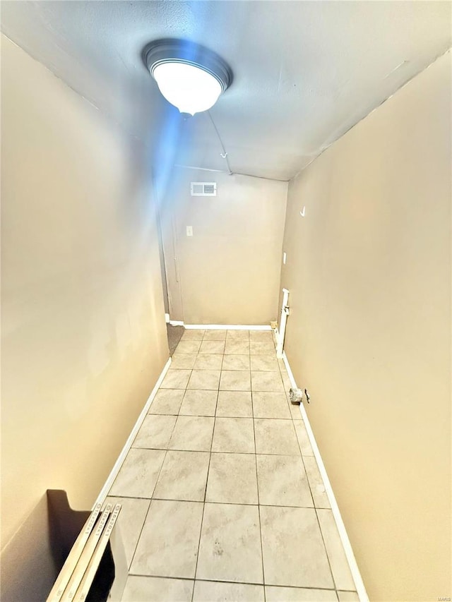 hallway with light tile patterned flooring