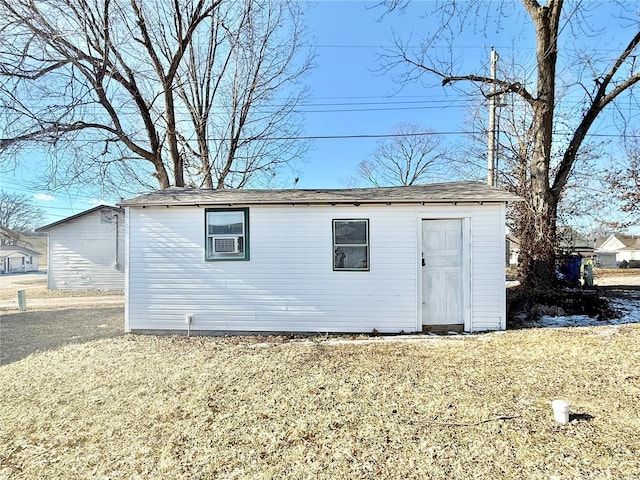 view of outbuilding with a lawn