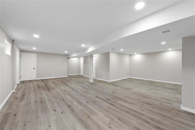 basement featuring light hardwood / wood-style flooring