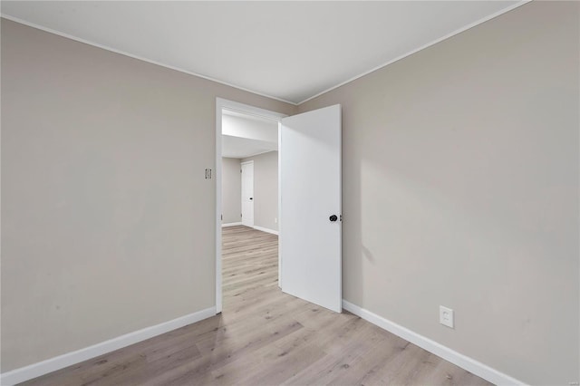 spare room featuring light wood-type flooring