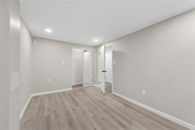 spare room featuring light hardwood / wood-style floors