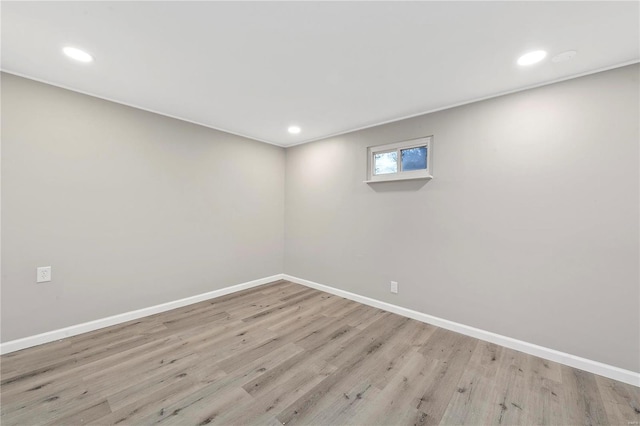 basement with light hardwood / wood-style floors