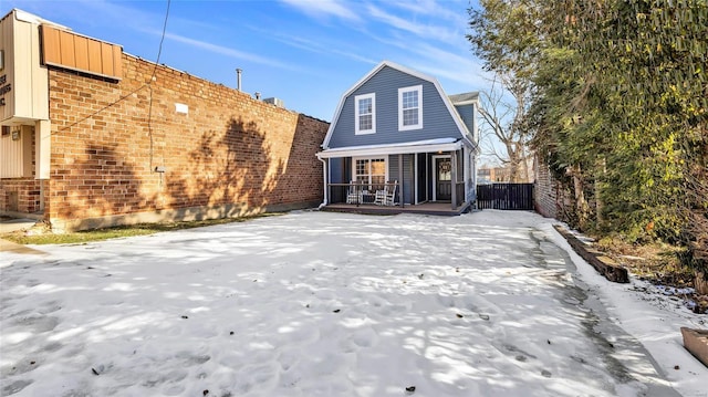 rear view of property with a porch