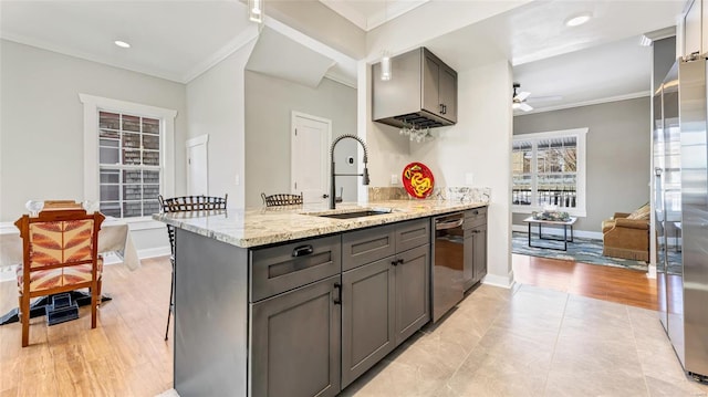 kitchen with dishwasher, ceiling fan, sink, kitchen peninsula, and light stone counters