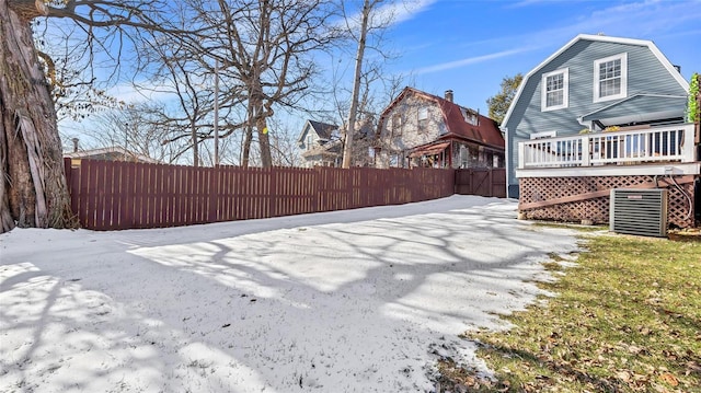 view of yard featuring central AC unit and a deck