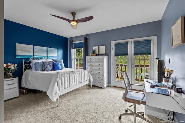 carpeted bedroom with ceiling fan, access to exterior, multiple windows, and french doors