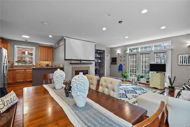 dining area with dark hardwood / wood-style flooring and sink