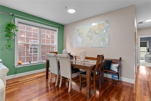 dining room with hardwood / wood-style flooring