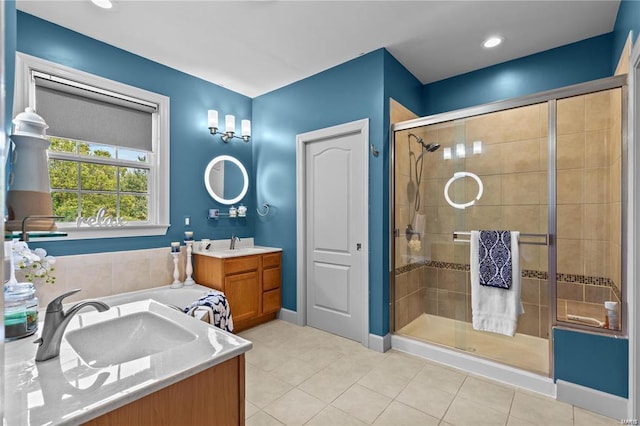 bathroom with a shower with shower door, tile patterned floors, and vanity