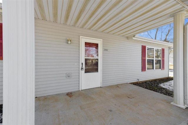 property entrance with a patio area