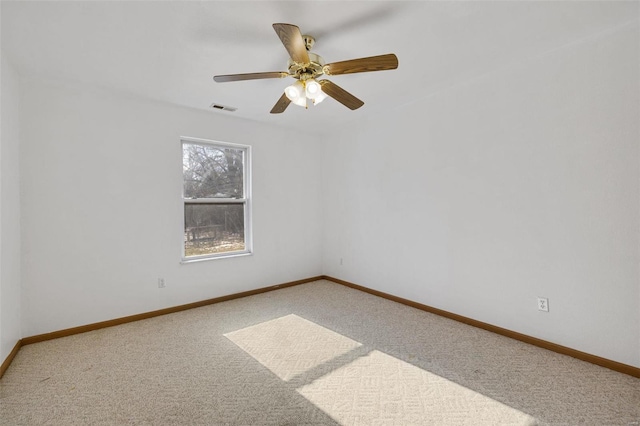 unfurnished room with ceiling fan and carpet floors