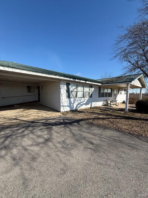 view of front of property with a carport