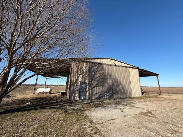 view of outbuilding with a rural view